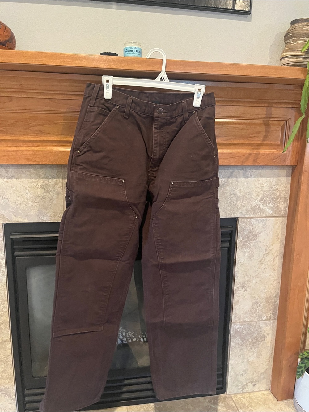 Carhartt men’s loose fit cargo pants in chocolate brown.